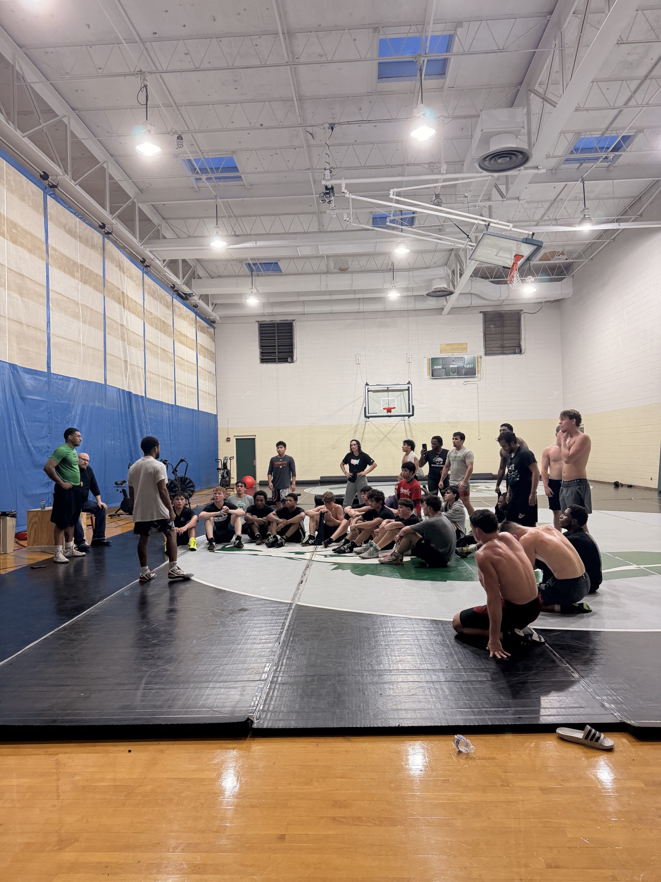 Caleb Smith sharing closing remarks with wrestlers at Greensboro RTC practice