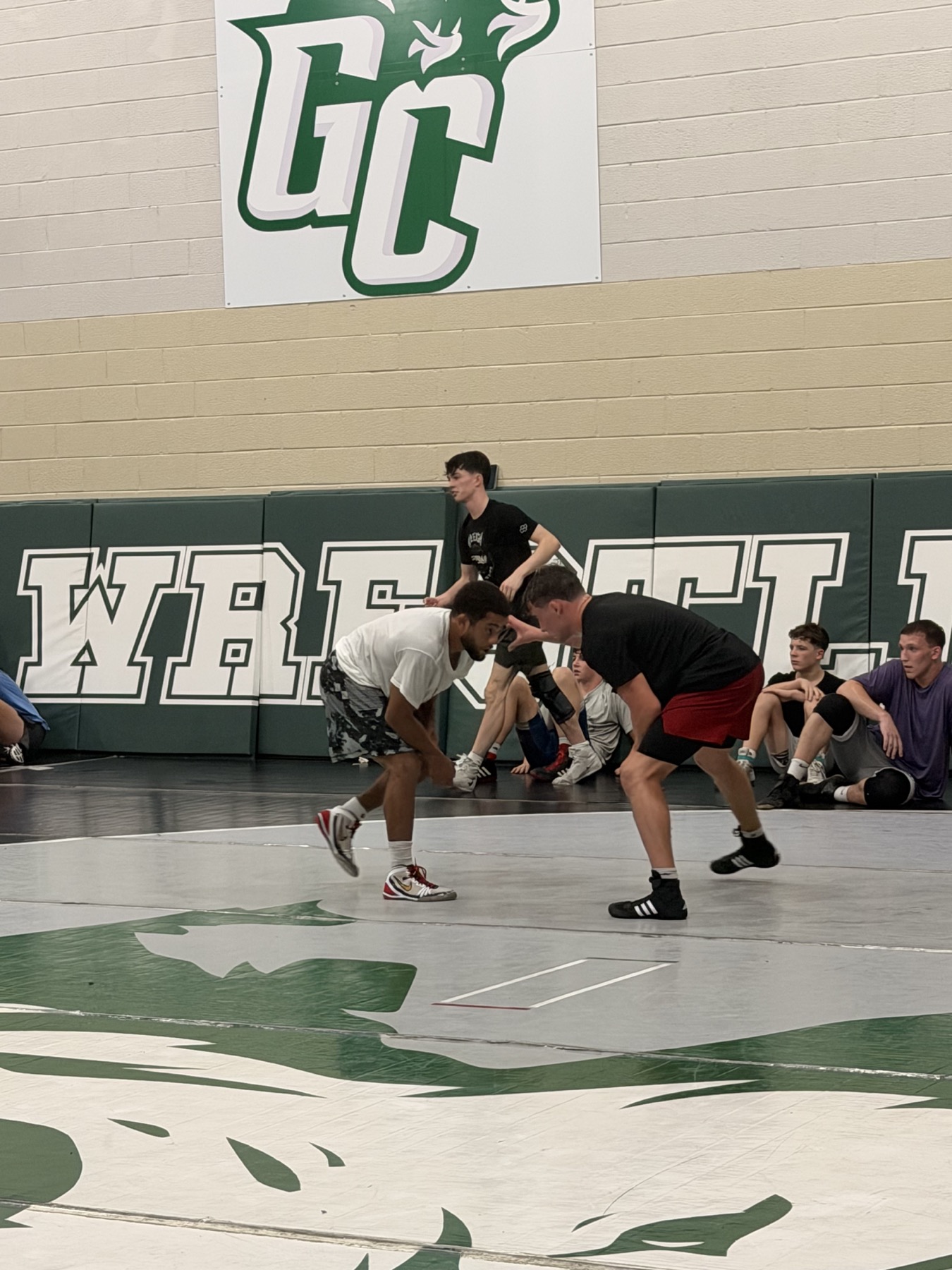Caleb Smith wrestling with an athlete during Greensboro RTC practice