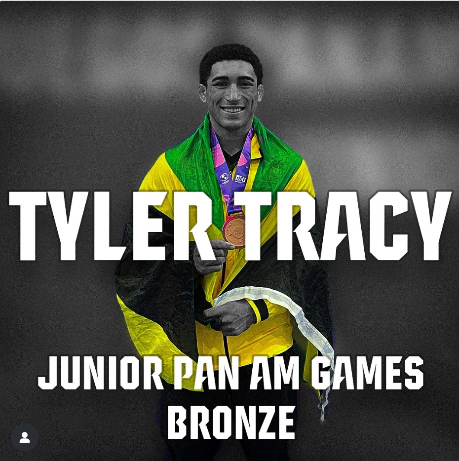 Tyler Tracy wearing Jamaica's flag after winning bronze at the Junior Pan American Games